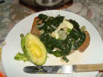 Beet greens with an egg on toast; and some avocado. Beet greens with an egg on toast; and some avocado.