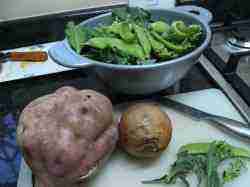 The ingredients for a rich vegetable soup using sweet potatoes, broccoli and peas with a chicken bones bouillon base.