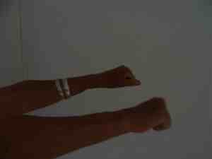 Make fists for this carpal tunnel exercise.