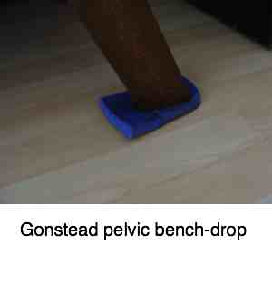 Gonstead pelvic bench with a cushion under the foot. Gonstead pelvic bench with a cushion under the foot.