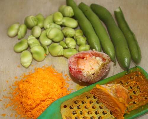 Young broad beans and pods with turmeric and peppers